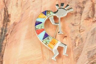 Genuine Turquoise, Spiny Oyster Shell, Sugilite and Blue Lapis inlaid in Sterling Silver. Kokopelli Brooch Designed by Navajo Artist Calvin Begay. Signed.